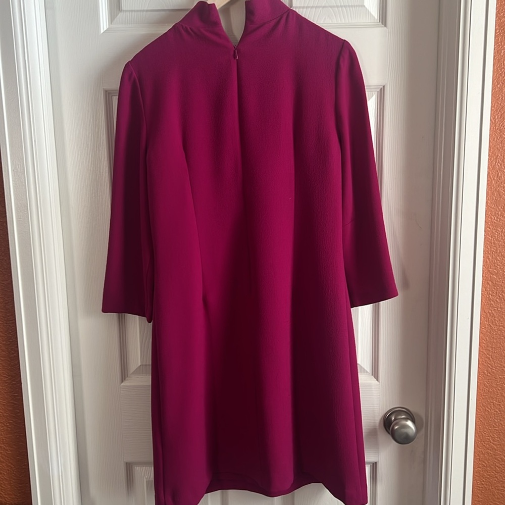 A line 3/4 sleeve fuschia dress with tab collar. Overall length 37”, see photos